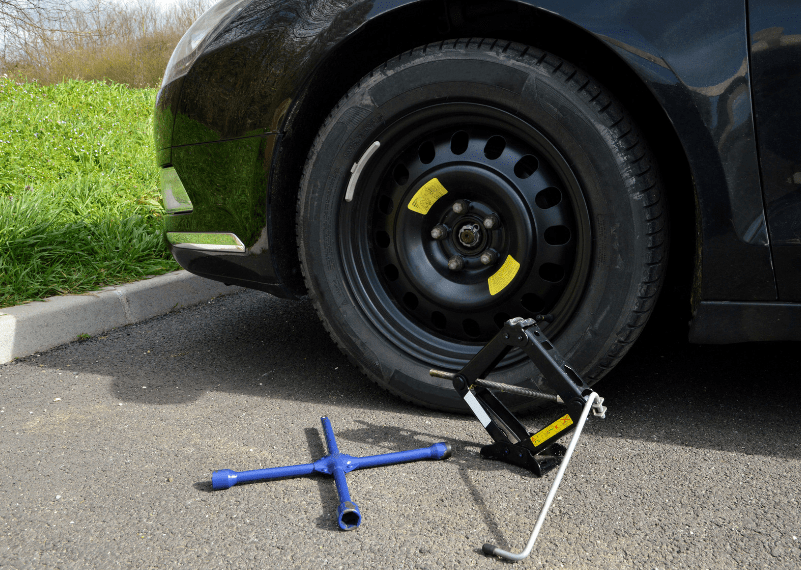 car changing spare tire