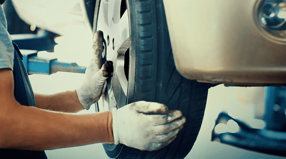 checking car tires before rain