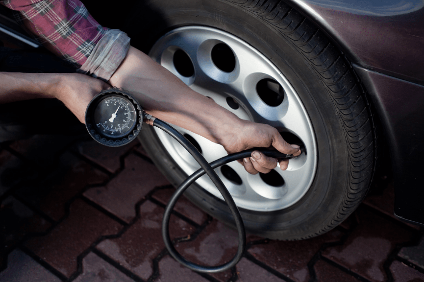 checking tire pressure and tread