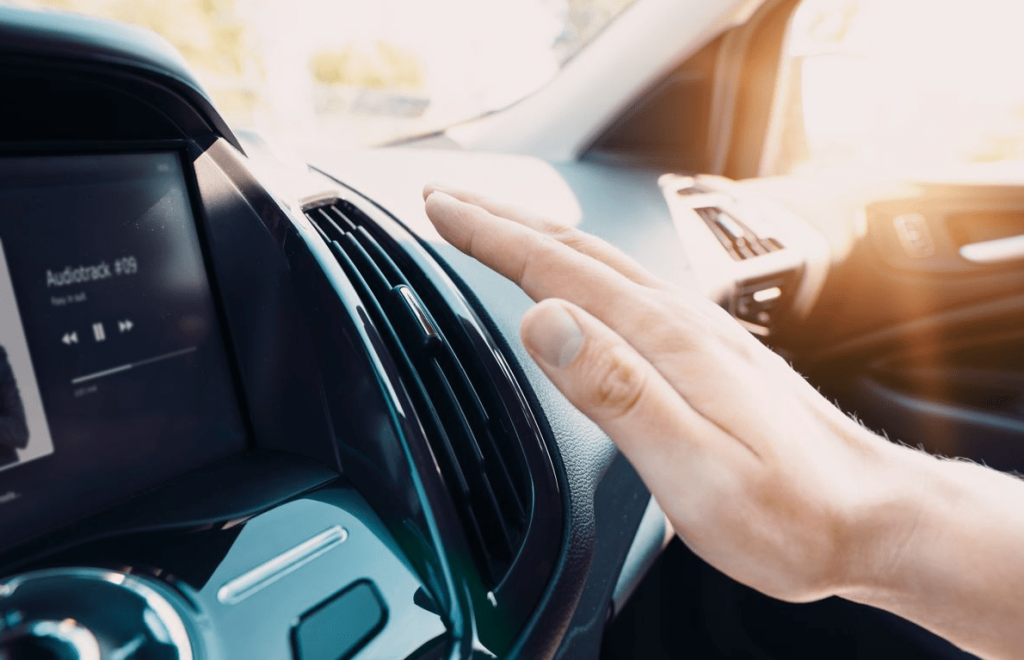 hand on car ac outlet