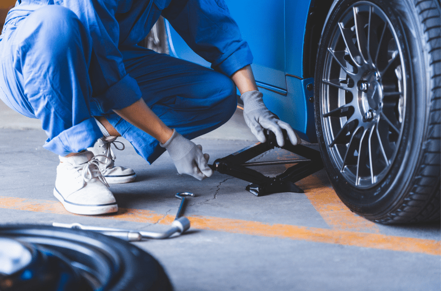 man changing car tires